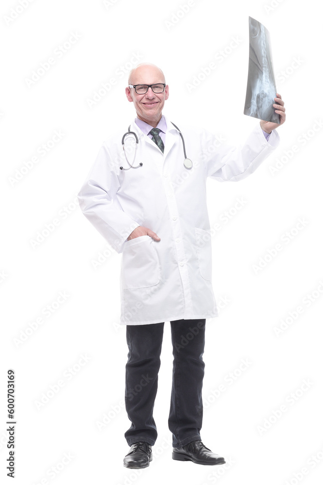 senior doctor with a stethoscope looking at an x-ray. senior doctor with a stethoscope looking at an x-ray.