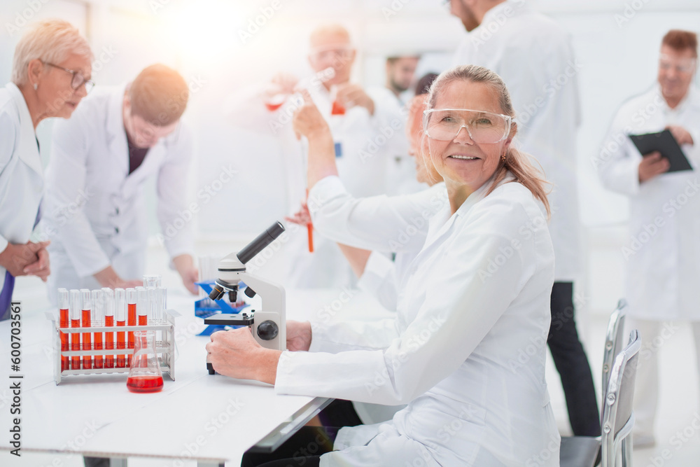close up. senior female scientist sitting at a laboratory table. close up. senior female scientist sitting at a laboratory table.