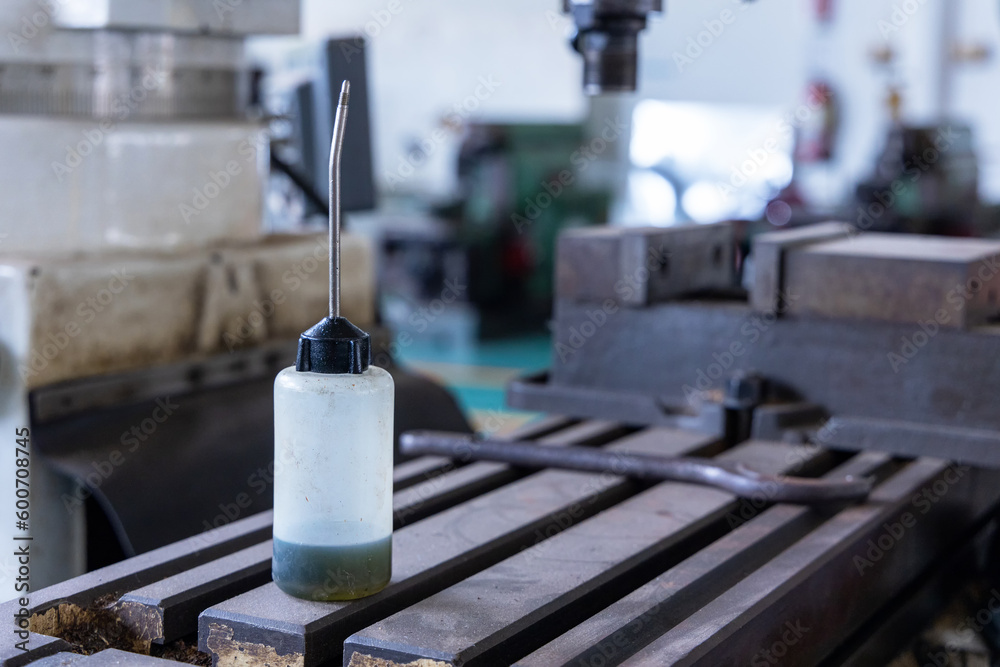 Sewing machine oil bottle for home and high professional sewing machine in factory or industrial plant. Sewing machine oil bottle for home and high professional sewing machine in factory or industrial plant.