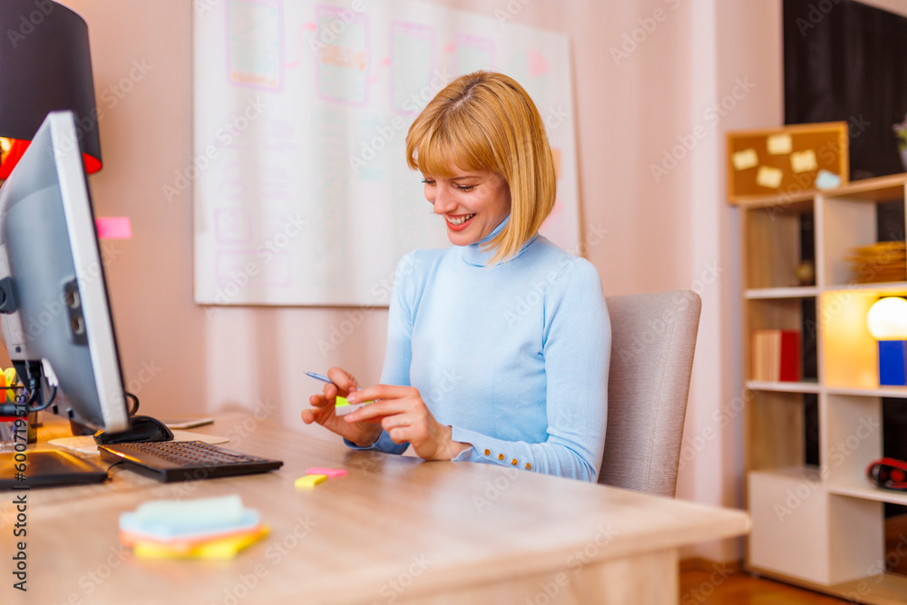 Woman brainstorming while working in home office Woman brainstorming while working in home office