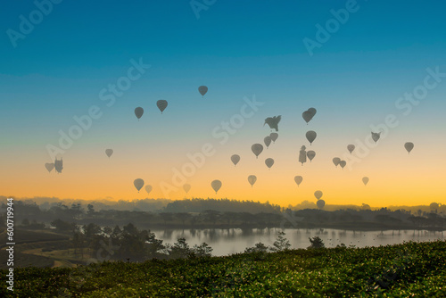 The scenery of hot air balloons floating in the sky in the morning