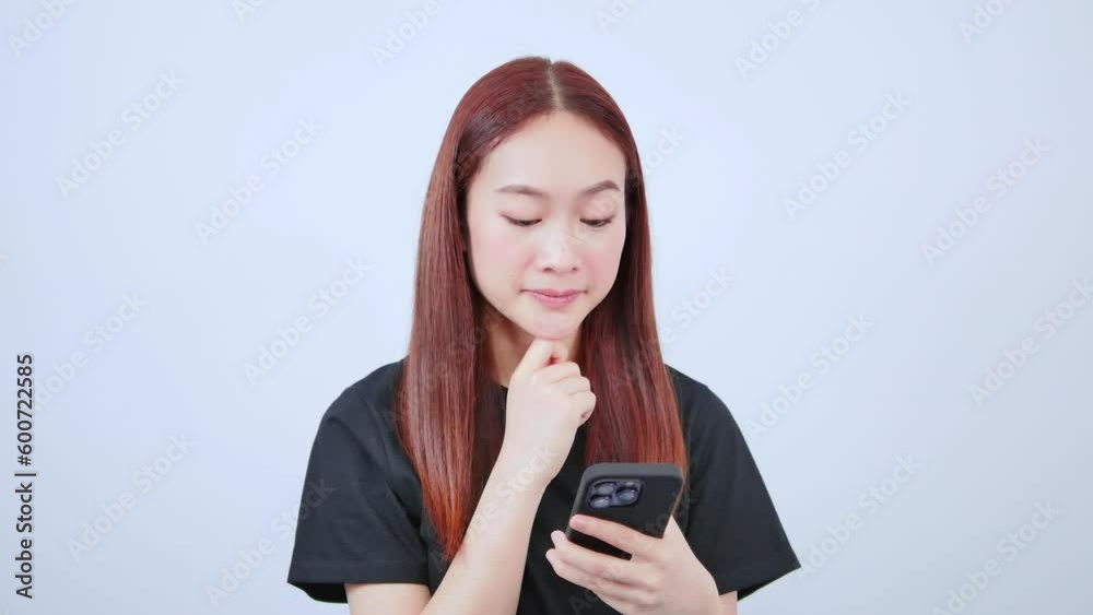 Freelancer playing mobile phone looking at smartphone standing Freelancer playing mobile phone looking at smartphone standing