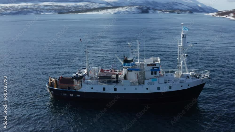Aerial Drone view Polar Fjord Cruise Ship Sailing in the Arctic Sea in Tromso, Norway. Aerial Drone view Polar Fjord Cruise Ship Sailing in the Arctic Sea in Tromso, Norway.