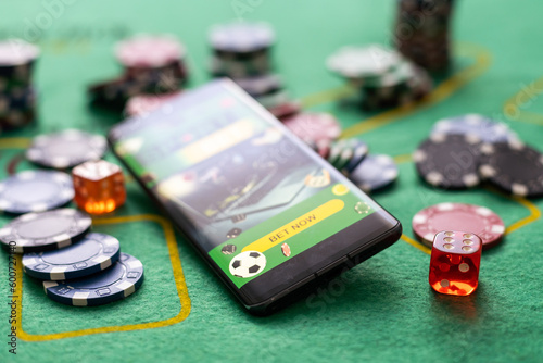 Slika na platnu smartphone sports betting casino on the background.