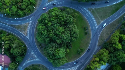 Aerial drone shot of a UK round about in High Wycombe, England. Cars driving. Camera rotates slowly clockwise. photo