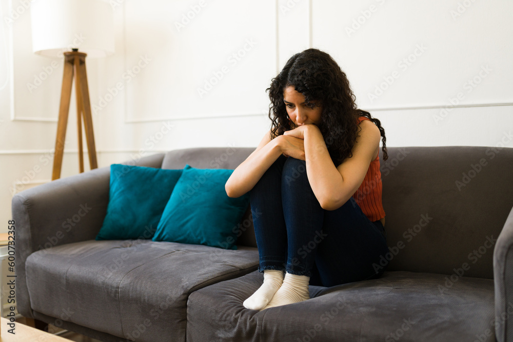 Sad young woman suffering from mental health problems