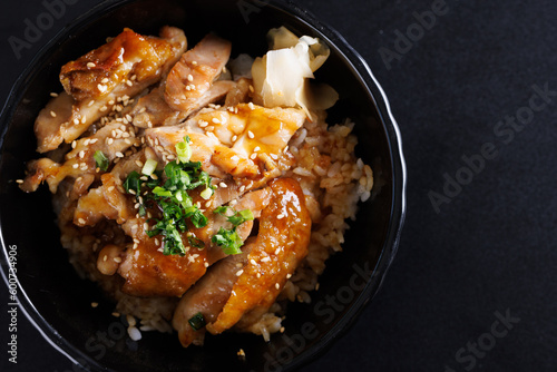 Grilled Chicken teriyaki rice Japanese food isolated in black background