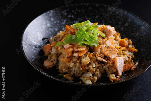 Japanese fried rice yakimeshi isolated in black background photo