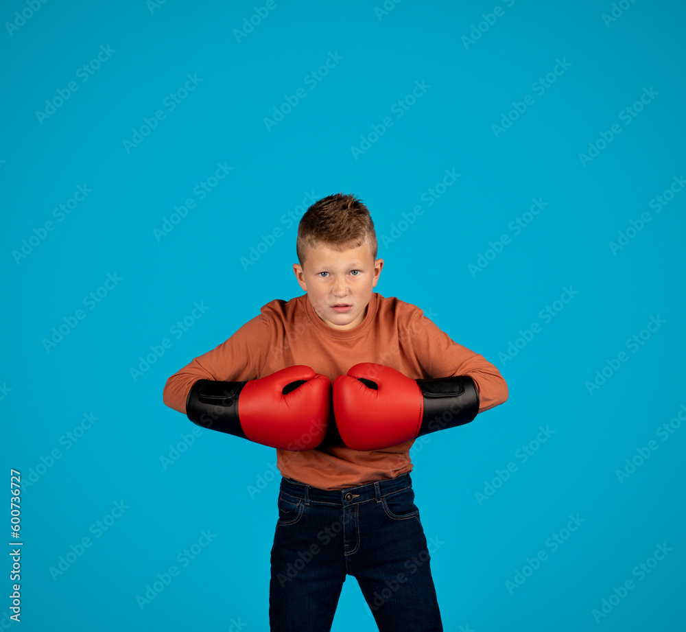 Aggressive Little Boy Wearing Boxing Gloves Putting Hands Together