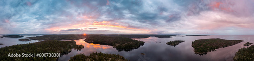 Sunrise in the wild. Dawn. Nature of Karelia. Pine on the shore of Lake Ladoga. Travel to Russia. Republic of Karelia. Islands. Northern nature. The sun above the water. photographed from heights © Grispb