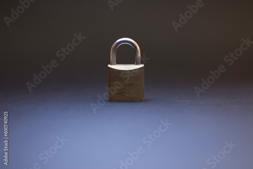 A metal padlock sits on a dark background, data protection Security concept
