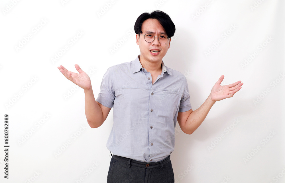 Asian man standing with confused gesture and expression. Isolated on white Asian man standing with confused gesture and expression. Isolated on white