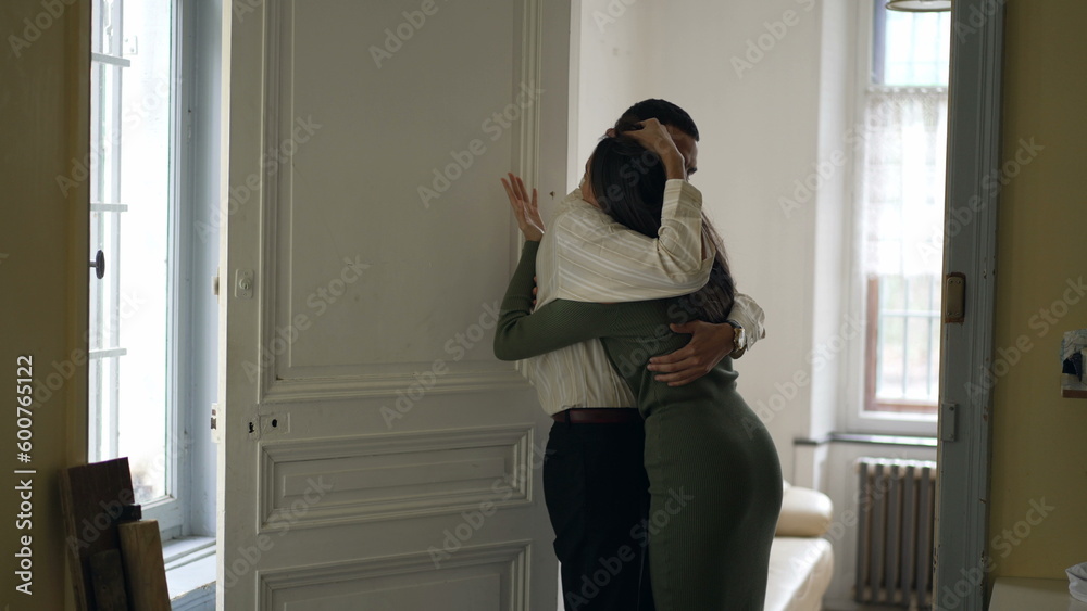 Boyfriend hugging frustrated argumentative girlfriend. Man reconciling with young woman embracing her so she can calm down Boyfriend hugging frustrated argumentative girlfriend. Man reconciling with young woman embracing her so she can calm down