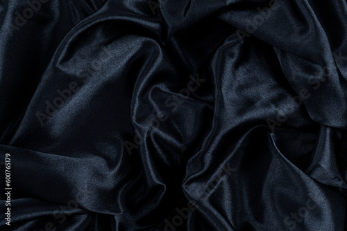 Abstract background black fabric, wavy folds. Texture, background
