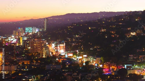 Aerial Forward Shot Of Illuminated Residential District With Mountains In Background At Night - Los Angeles, California