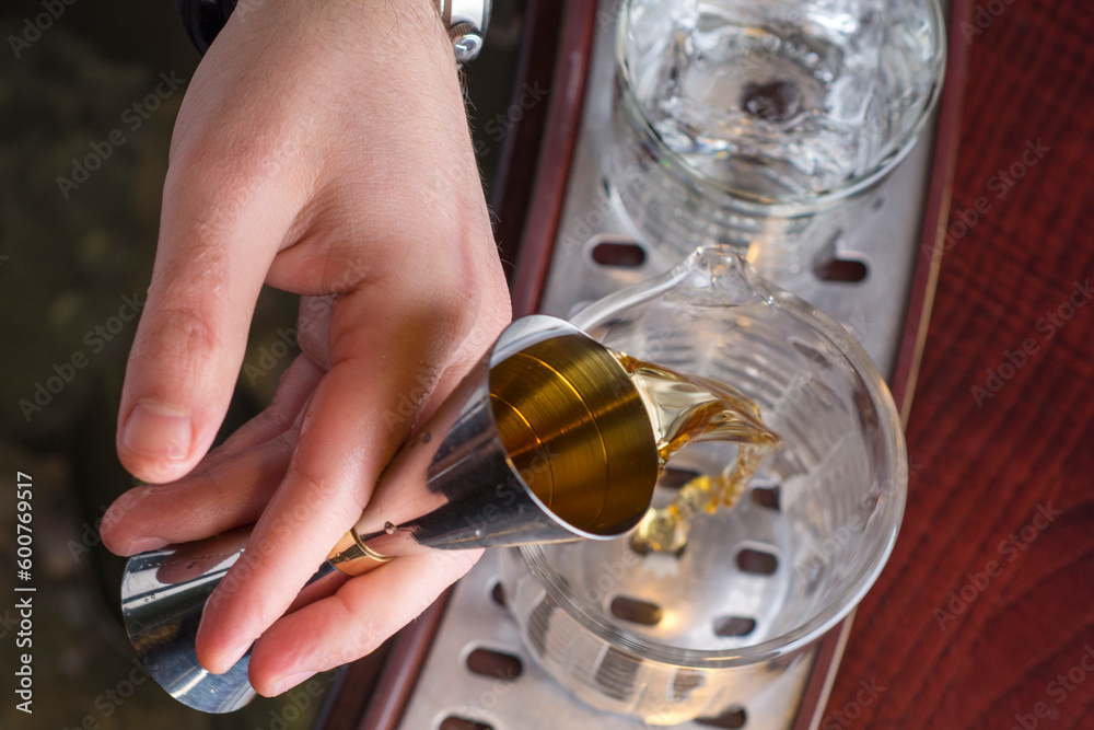 Bar and bartenders making coctails, closeup details