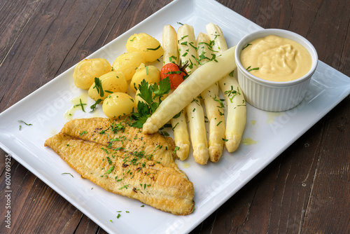 plaice fillet white asparagus and boiled potatoes with hollandaise sauce