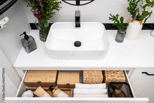 Fotografija bath accessories, washbowl and mixer in washroom