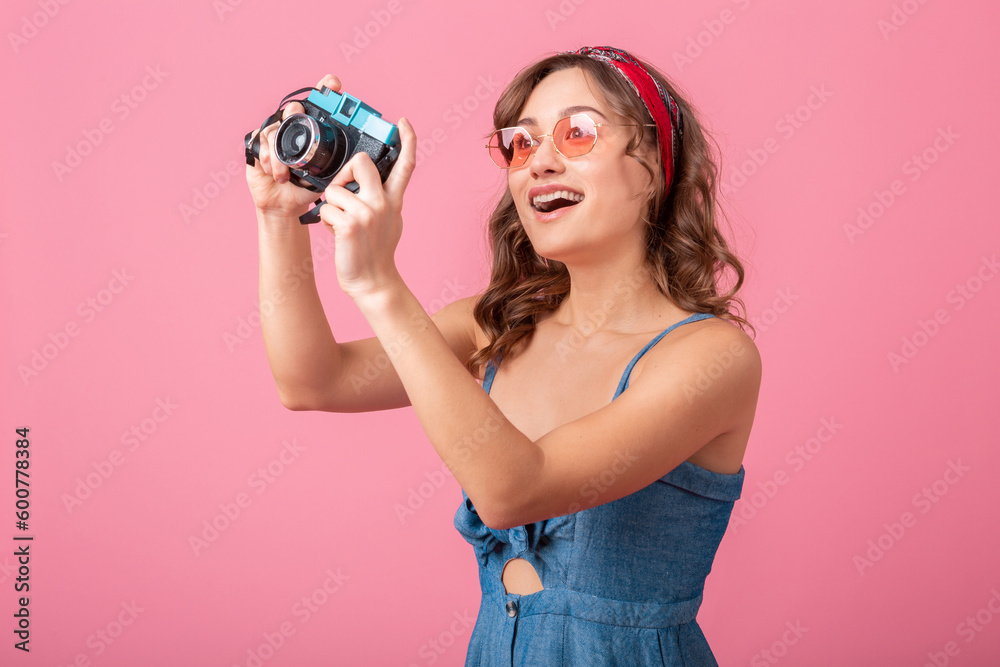 attractive smiling happy woman posing with vintage photo camera