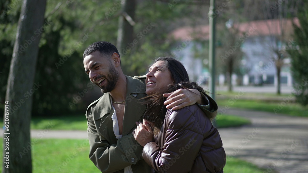 Happy Arab Couple Enjoying Sunny Stroll at Park with Genuine Laughter and Smiles Happy Arab Couple Enjoying Sunny Stroll at Park with Genuine Laughter and Smiles