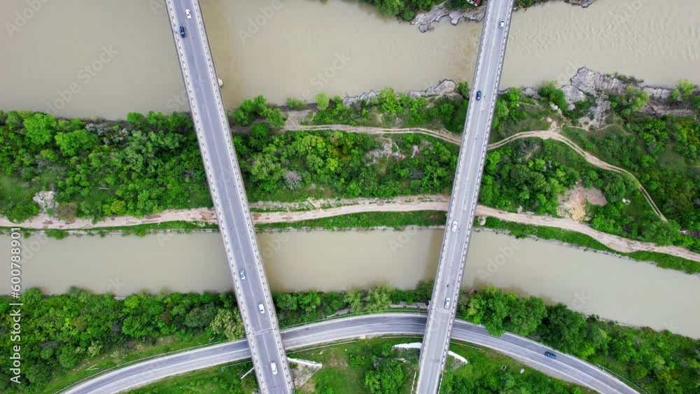 Intersecting Rivers Drone view of contemporary bridge intersection above river. Zoom out ...