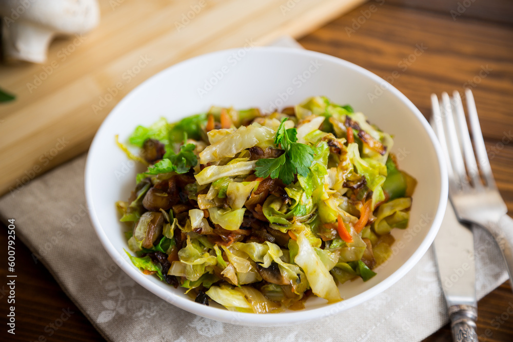 cabbage early fried with mushrooms, carrots and vegetables cabbage early fried with mushrooms, carrots and vegetables