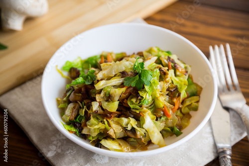 cabbage early fried with mushrooms, carrots and vegetables