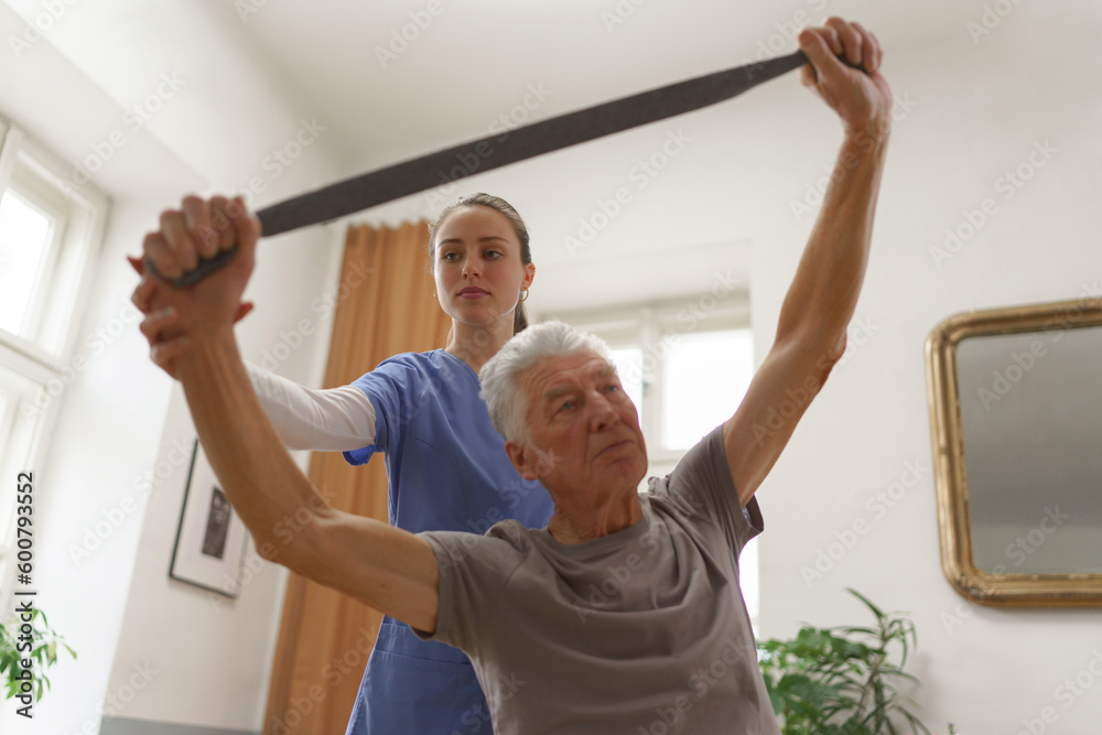 Young nurse doing exercise with senior man. Young nurse doing exercise with senior man.