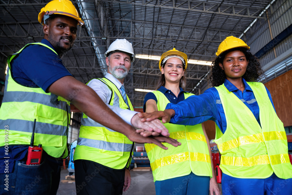 Confident Manager visit engineer teamwork at manufacture factory gathering hands portrait together Confident Manager visit engineer teamwork at manufacture factory gathering hands portrait together