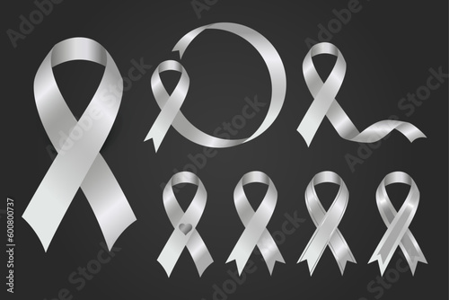 Silver awareness ribbon used to represent many causes including brain disorders and disabilities, limb loss, and schizophrenia. photo