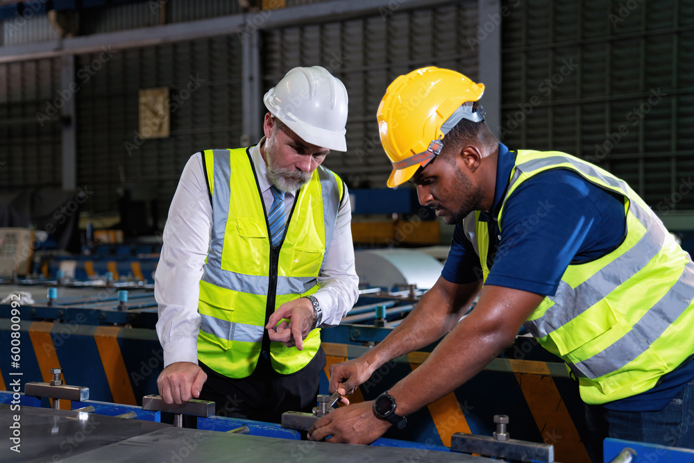 Plant manager visit engineer in factory at production line discuss on quality assurance improvement Plant manager visit engineer in factory at production line discuss on quality assurance improvement