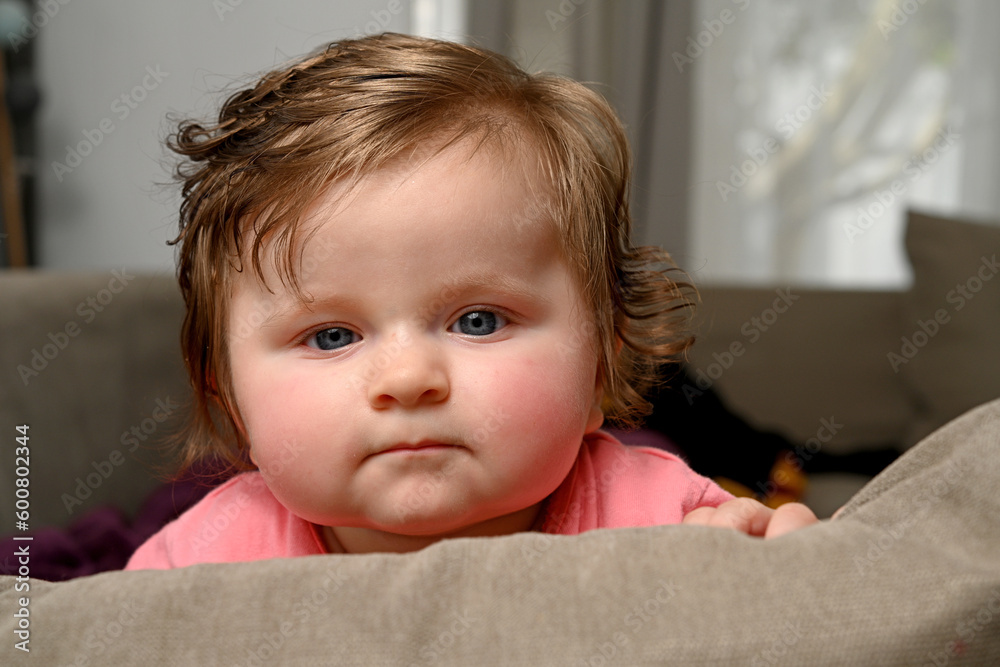 newborn baby sitting on sofa newborn baby sitting on sofa