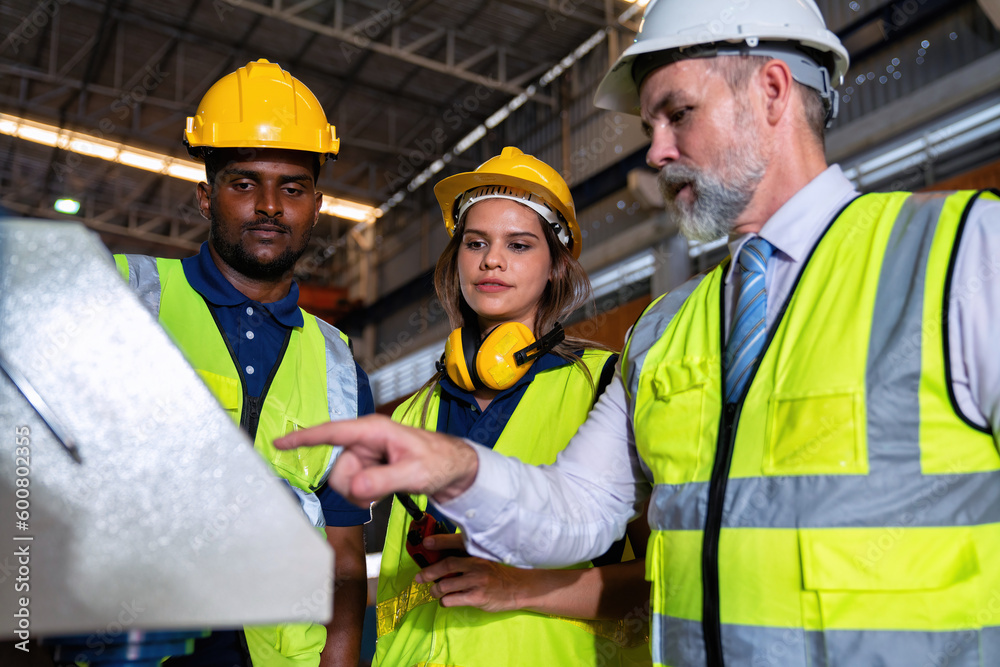 Plant manager visit engineer in factory at production line discuss on quality assurance improvement Plant manager visit engineer in factory at production line discuss on quality assurance improvement