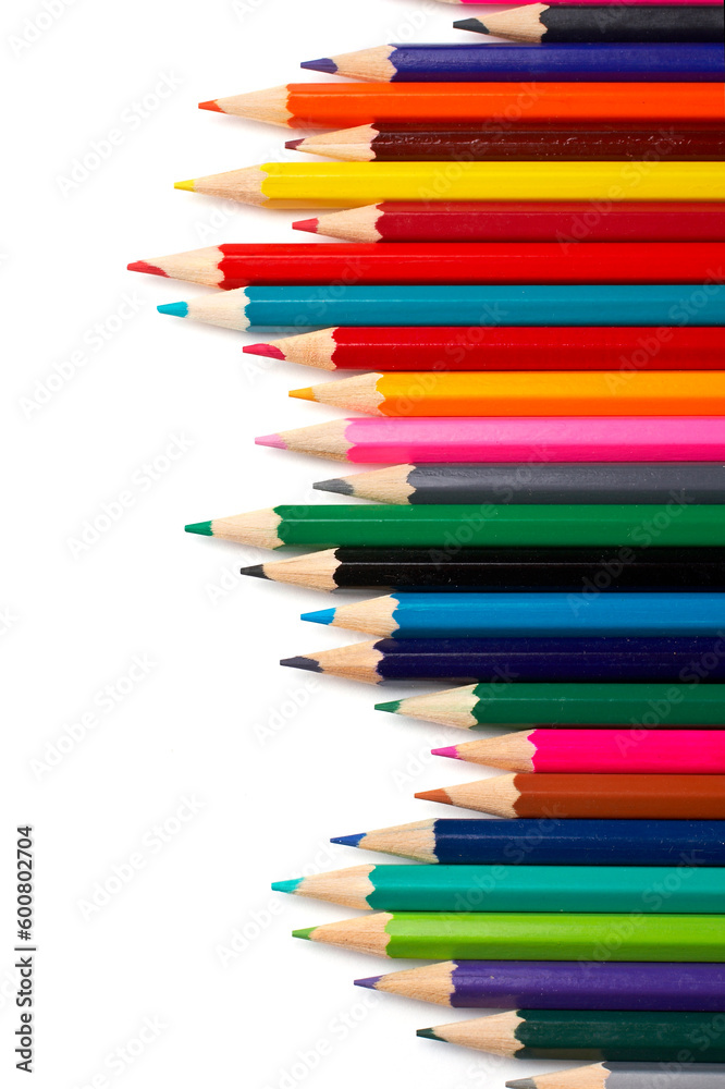 Fototapeta premium Assortment of coloured pencils with shadow on white background
