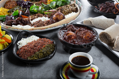 A view of assorted Ethiopian entrees, featuring a combination platter. photo