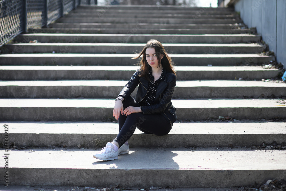 Girl on a walk through the spring city