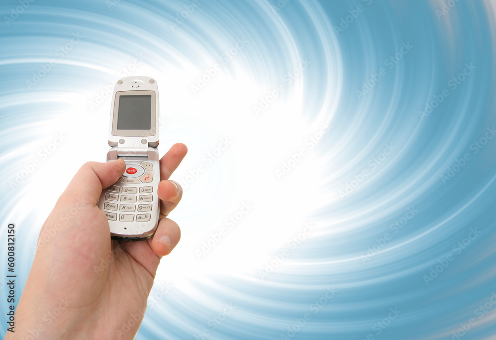 Cell phone in a man hand. Distorting effect Cell phone in a man hand. Distorting effect