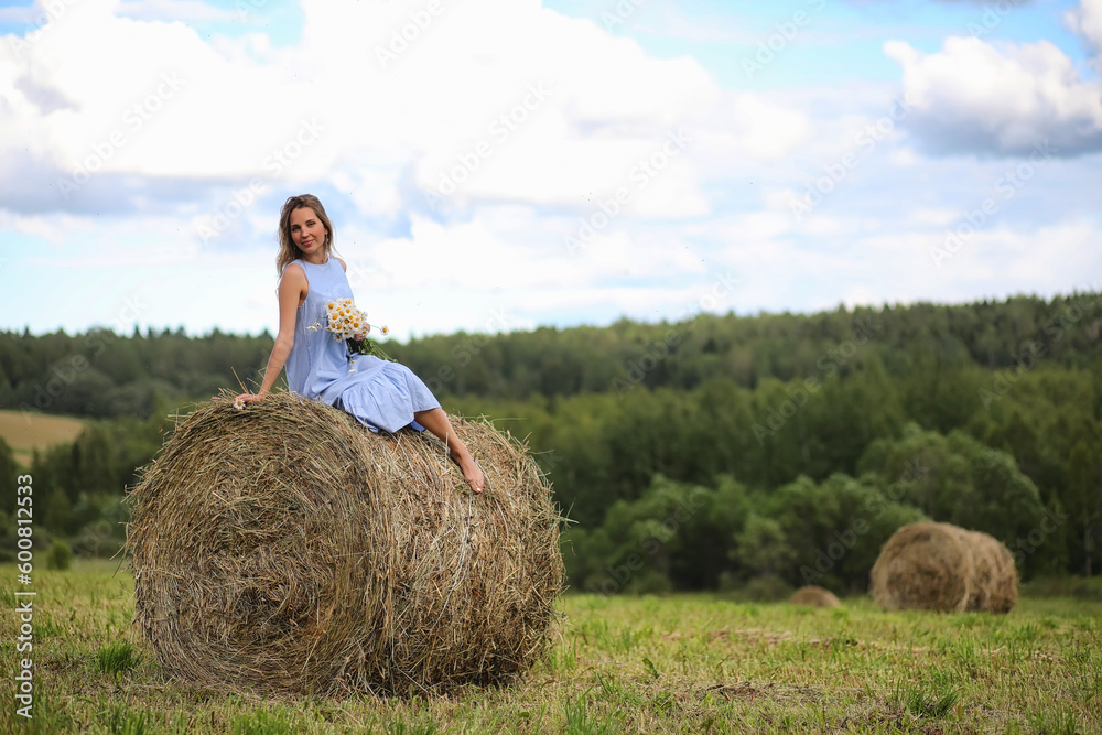 Two girls in dresses in summer field Two girls in dresses in summer field