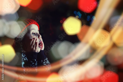 Little girl in red hat waiting for santa