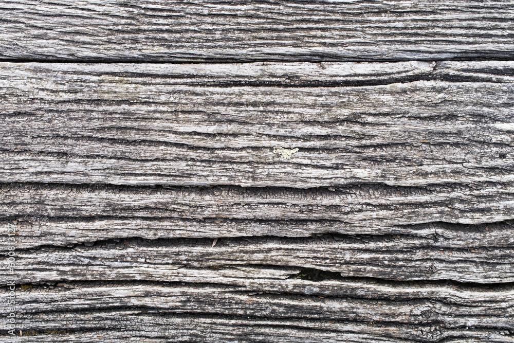 Close-up of wood planks aged outdoors and very textured with gray tones. Close-up of wood planks aged outdoors and very textured with gray tones.