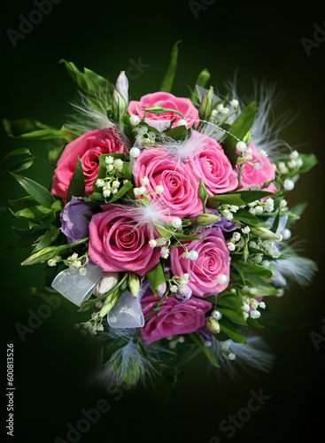 Wedding bouquet from roses on a green background