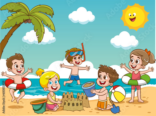 Children kids sunbathe swiming in the sea at summer children's camp on sea beach shore. Little boy are playing with ball. The children on the beach are building a sand castle.