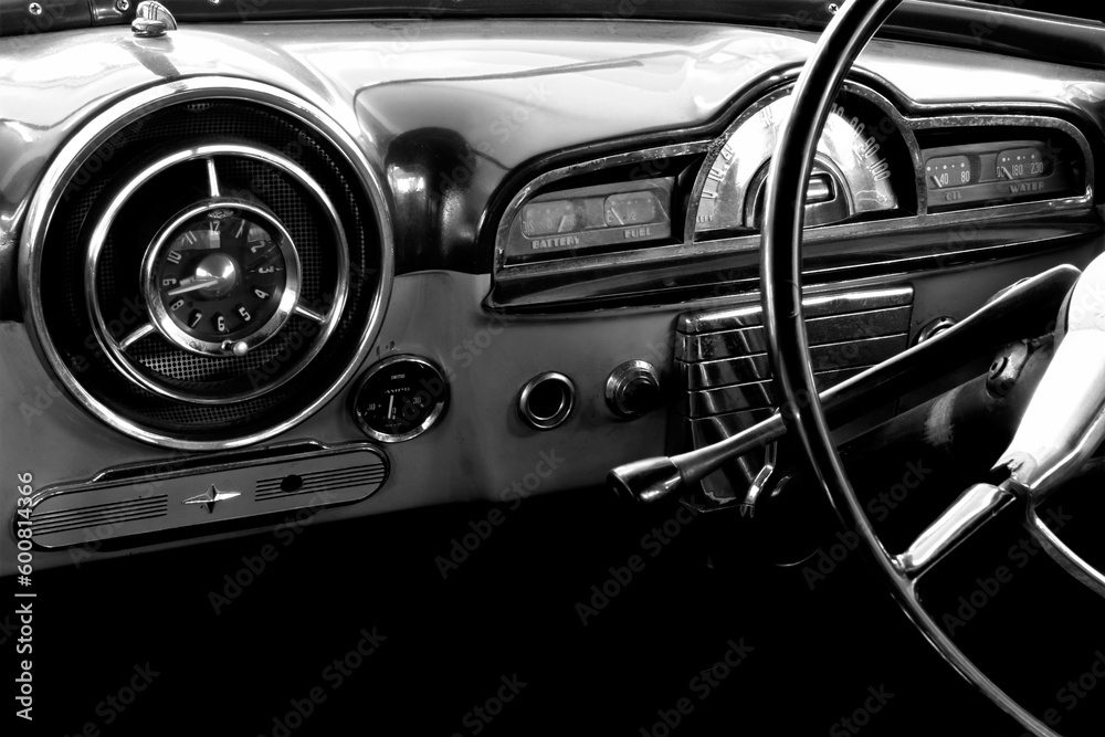 View of the interior of an old vintage car in black and white