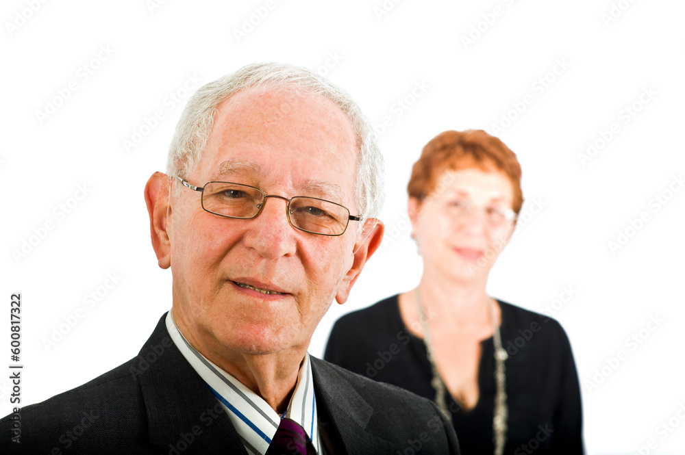 closeup portrait off a senior businessman with colleague in the background isolated on white closeup portrait off a senior businessman with colleague in the background isolated on white