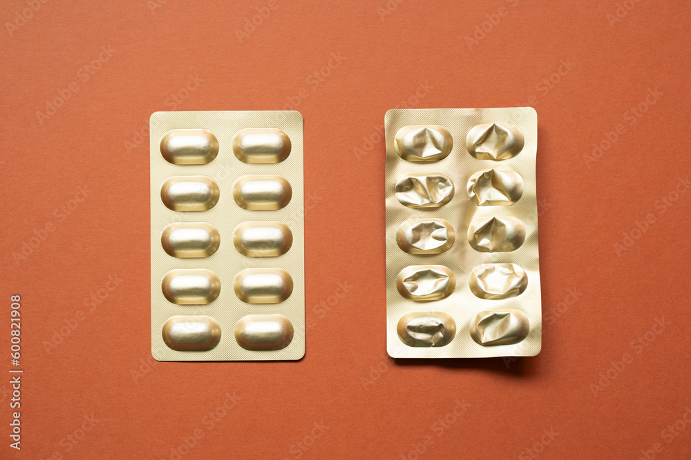 Blister pack. Pharmacy drug pill capsule package isolated on red background. top view, copy space