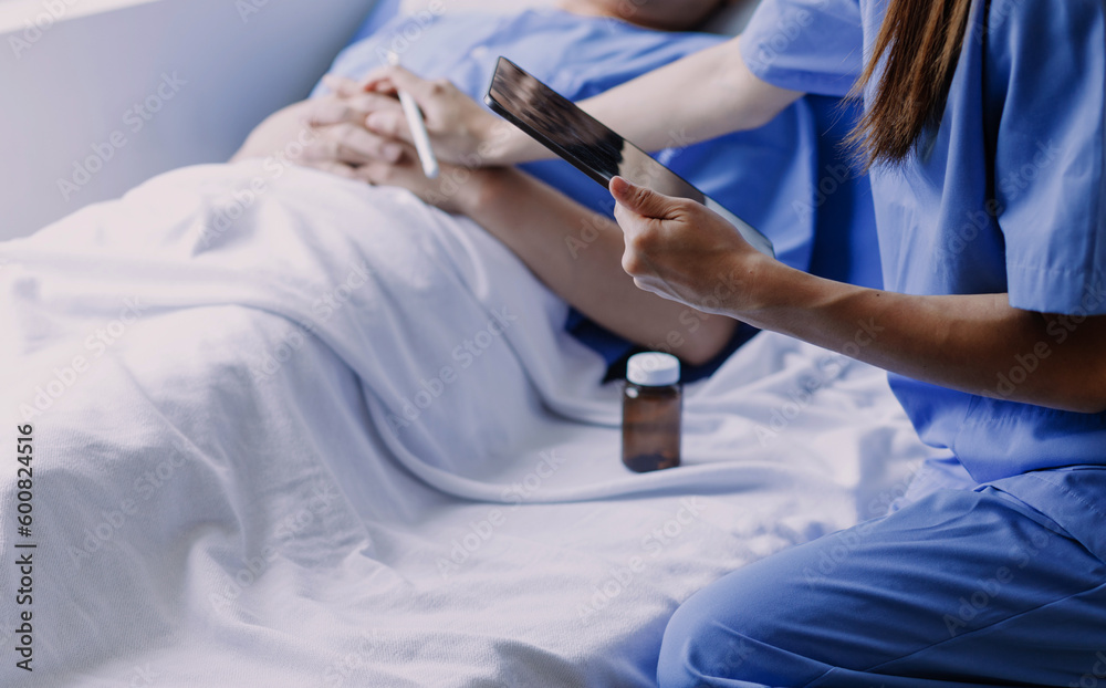 doctor check up after surgery. doctor touching patient hand and consoling. doctor check up after surgery. doctor touching patient hand and consoling.