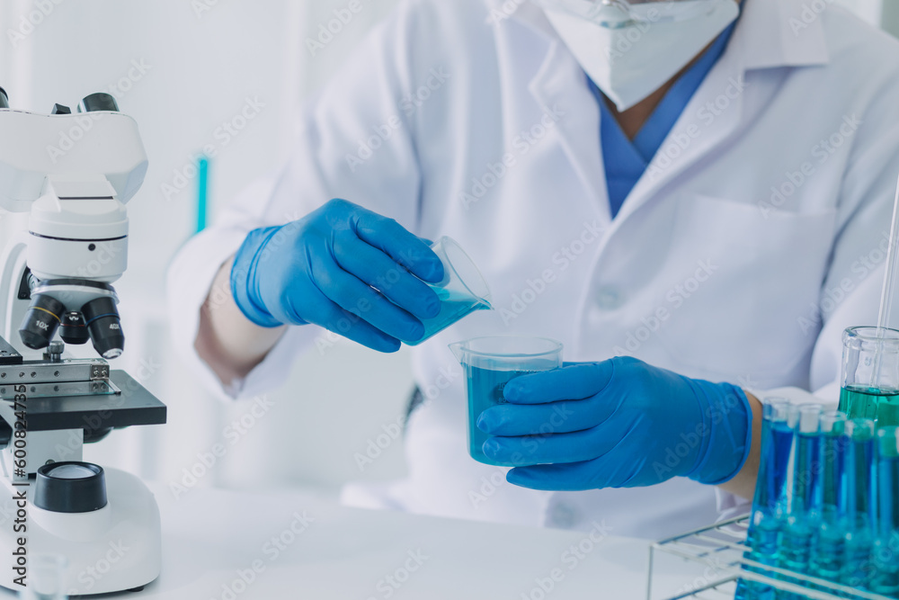 Fototapeta premium Medical Development Laboratory: Caucasian Female Scientist Looking Under Microscope, Analyzes Petri Dish Sample. Specialists Working on Medicine, Biotechnology Research in Advanced Pharma Lab