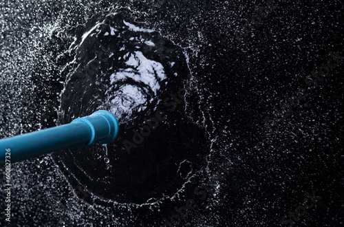 Sprinkler watering isolated on black background