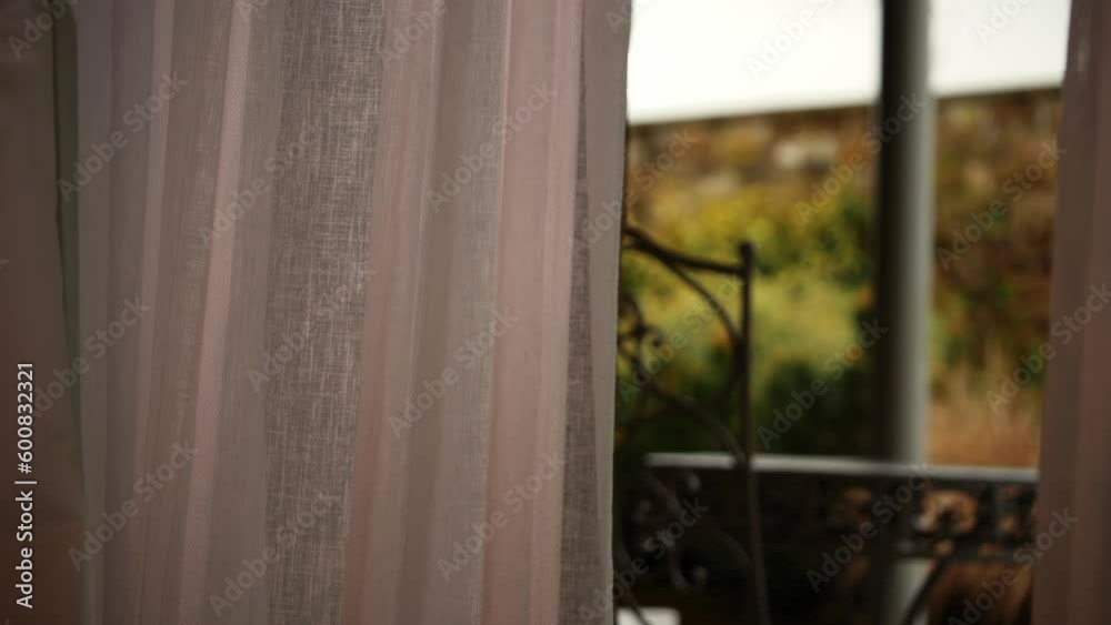 Curtains reveal patio view of countryside hotel Curtains reveal patio view of countryside hotel
