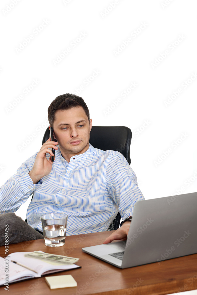 man working with laptop and having phone conversation man working with laptop and having phone conversation